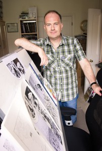 Mark-Buckingham-studio-Turnham-Green-London-W4-standing-upright-by-board-col-pic#2-30th-july-2015